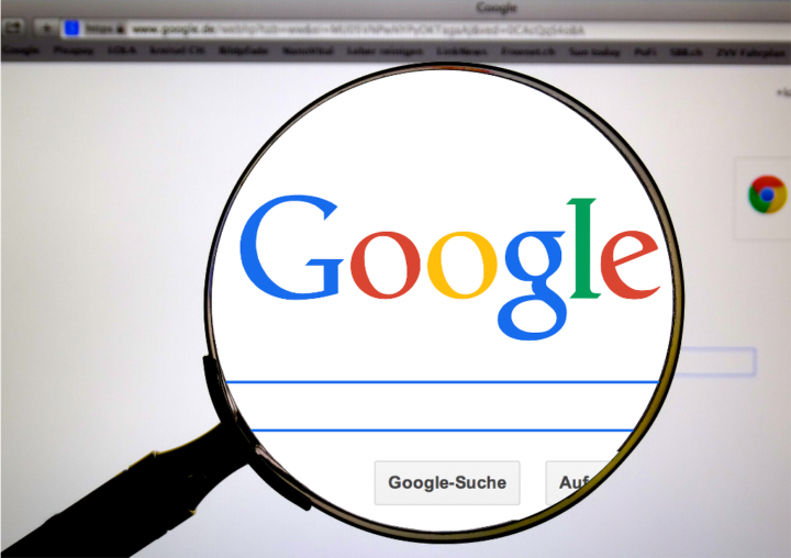 Google logo and a magnifying glass
